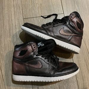 Brown and black metallic Jordan’s